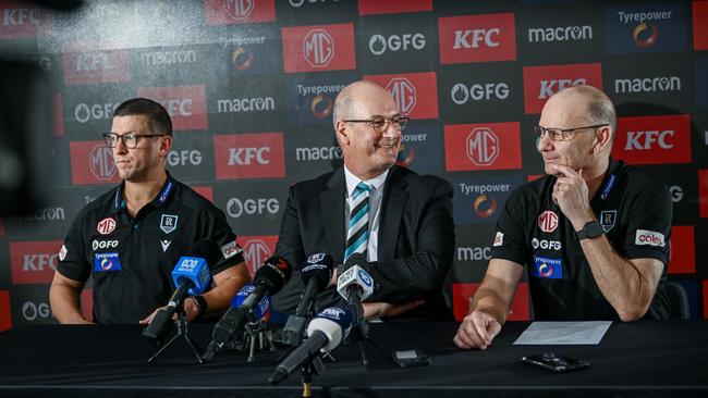 ADELAIDE, AUSTRALIA - FEBRUARY 12:Josh Carr senior assistant coach of Port Adelaide  ,Port Adelaide Football Club chairman David Koch and Ken Hinkley senior coach of Port Adelaide  speak to the media during a Port Adelaide Power AFL press conference at Alberton Oval on February 12, 2025 in Adelaide, Australia. (Photo by Mark Brake/Getty Images)