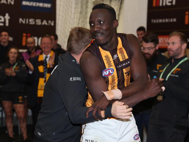 Mitchell embracing Mabior Chol after a win. Picture: Getty Images