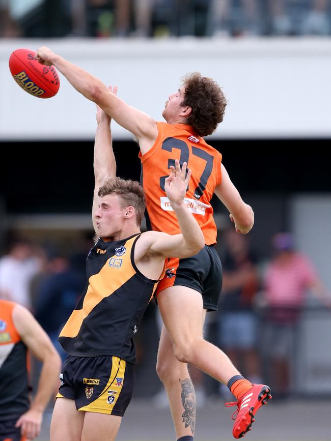 GFL: Geelong West Giants v Grovedale. Geelong West's Josh Dwyer punches the ball away. Picture: Mike Dugdale