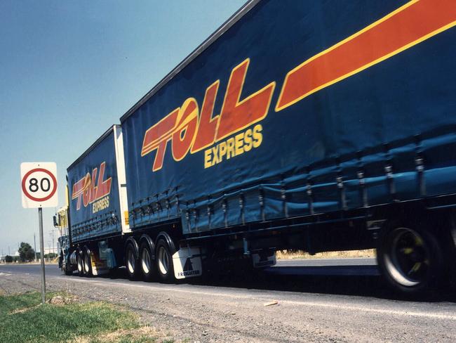 Undated. Toll Holdings Toll Express 25m racked tautliner B-Double semi trailer motor truck. PicSupplied  transport 80 kph road speed sign signs motor vehicles trucks logo logos