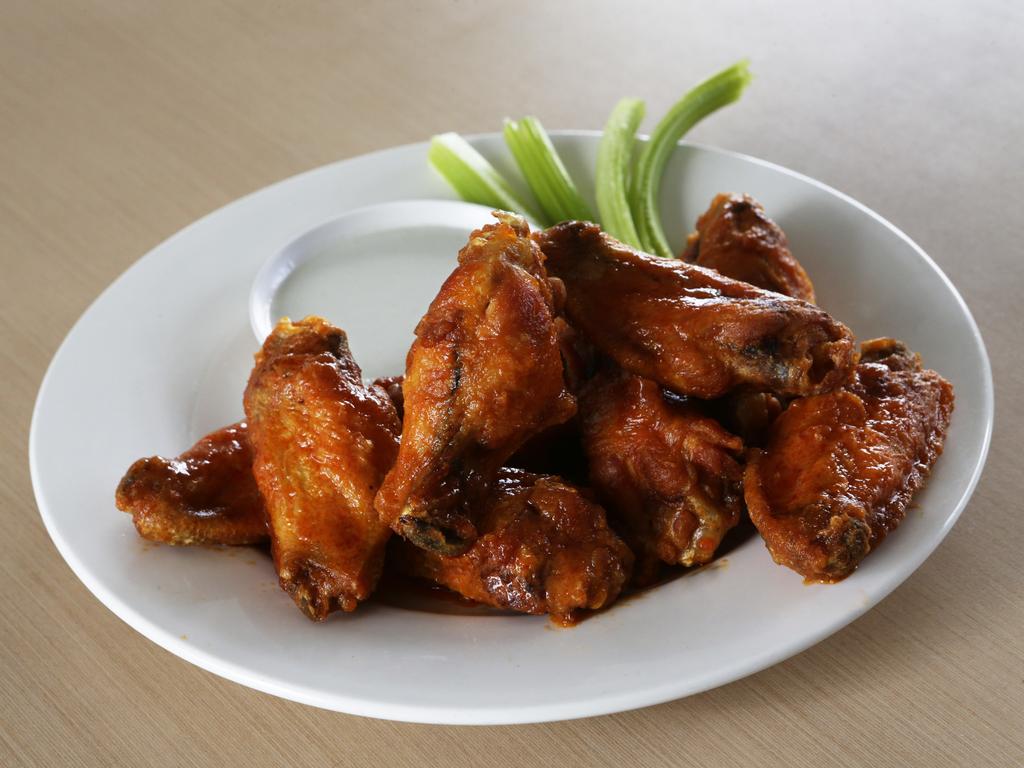 <span class="h2">The Smoke BBQ</span>                  <b>9/85 Merthyr Rd, New Farm. Price: Five for $11.</b> Never tried buffalo wings? Then get yourself to The Smoke. The smell of the piping hot, saucy wings hits you as soon as they land on the table, packing enough heat to leave your lips tingling and thick enough to properly stick to the wings. The blue cheese dressing is easily the best version we’ve tasted with a strong tang. They may be the priciest on the list, but these were our clear winners, by far. <b><a href="http://thesmokebbq.com.au/" title="thesmokebbq.com.au">More details</a></b>