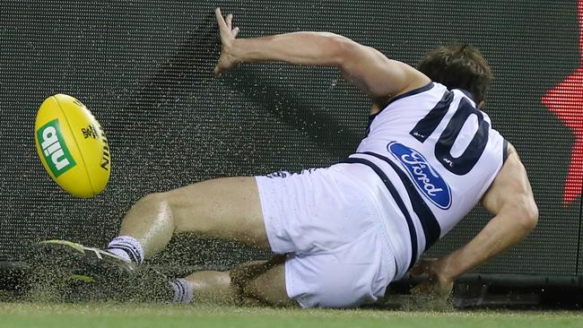 Daniel Menzel slams into the fence. Picture: Michael Klein