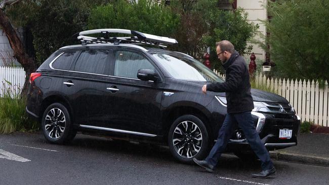 Greens MP Adam Bandt getting into his car outside his Melbourne home. Picture: Sarah Matray