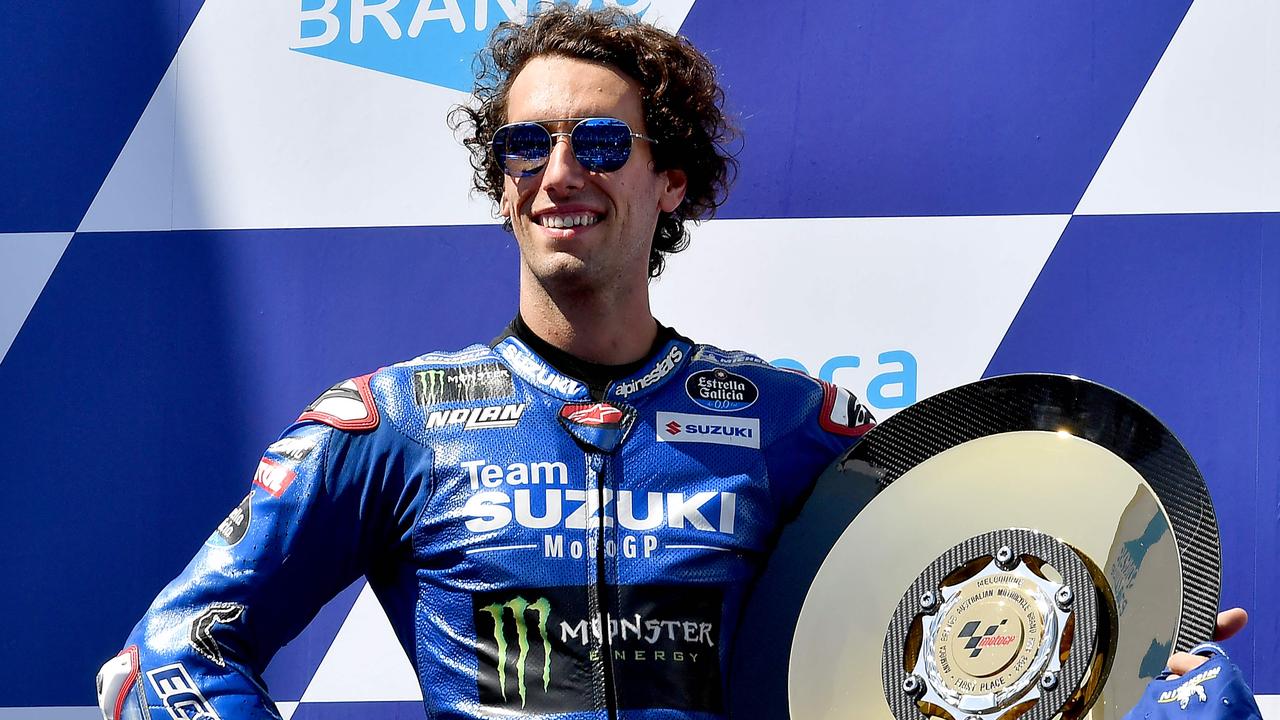 Suzuki Ecstar's Spanish rider Alex Rins poses for a photo after his win.