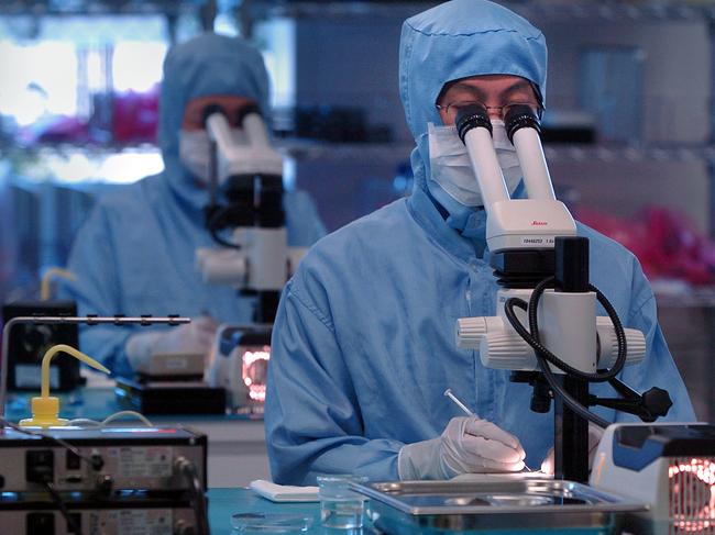 Cochlear Ltd. technicians work at the company's production facility in Sydney, Australia, Wednesday, November 9, 2005. Cochlear is the world's largest maker of inner-ear hearing devices. Photographer: Jack Atley/Bloomberg News