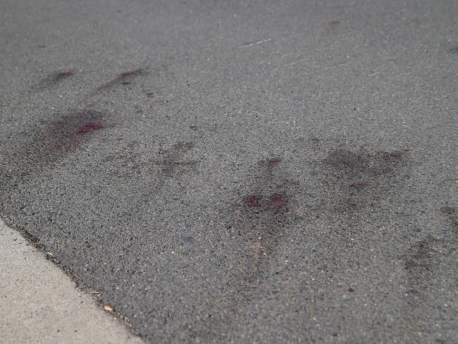 Blood stains on the road where an officer was stabbed. Picture: Danny Aarons