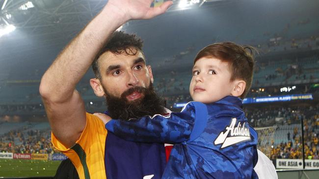 Australia's Mile Jedinak greets the crowd after defeating Honduras.