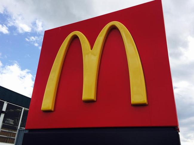 Generic McDonald's sign (the golden arches) with clouds in the background at Marsden Park. Fast food giants/unhealthy food/takeaway food. Generic Marsden Park photos.