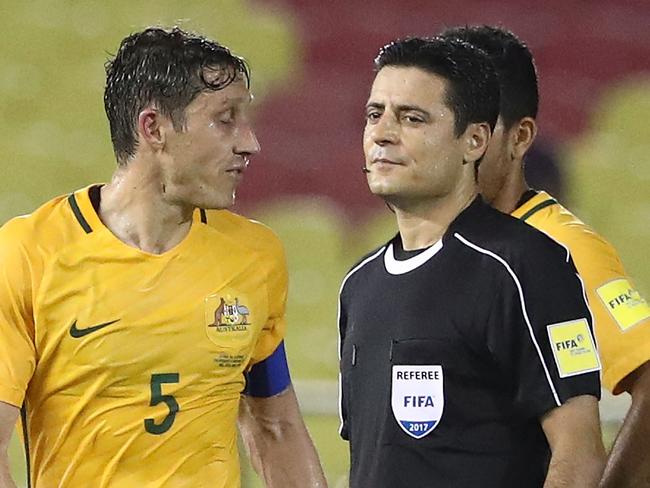 MALACCA, MALAYSIA - OCTOBER 05:  Mark Milligan of Australia speaks to referee Alireza Faghani after the 2018 FIFA World Cup Asian Playoff match between Syria and the Australia Socceroos at Hang Jebat Stadium on October 5, 2017 in Malacca, Malaysia.  (Photo by Robert Cianflone/Getty Images)