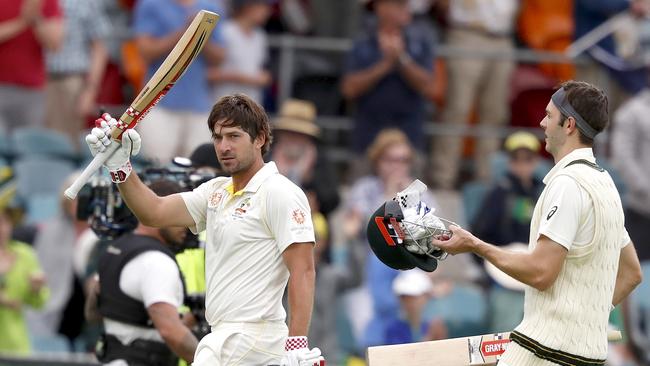 Australia’s Joe Burns (left) acknowledges applause from the crowd as he leaves the field yesterday. Picture: AAP