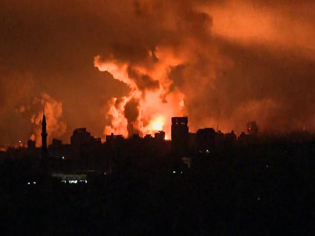 Balls of fire and smoke rising above Gaza City during an Israeli strike on October 27, 2023. (Photo by Yousef Hassouna / AFP)