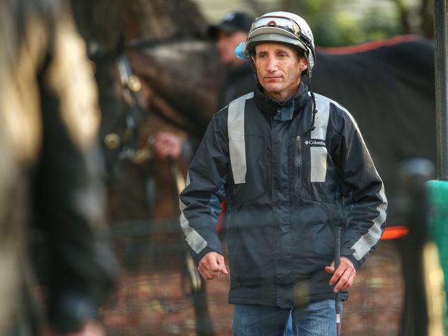 Jockey Damien Oliver leaves trackwork the morning after his spring was cast into chaos with a 20-meeting suspension. Picture: Colleen Petch