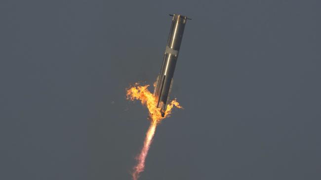 The booster of SpaceX's mega rocket Starship is recaptured during a test flight in Texas. Picture: AP