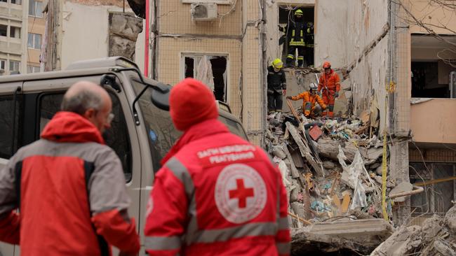 Rescuers work at the site of a heavily damaged multi-story apartment building, following a Russian drone attack, in Odesa, on March 2, 2024. (Photo by Oleksandr GIMANOV / AFP)