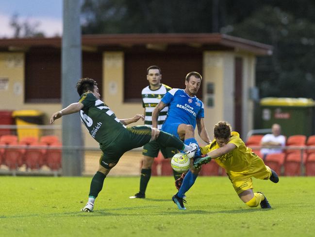 Brodie Welch of South West Queensland Thunder is denied by Western Pride keeper Tom Lynch and defender Ryu Yonezawain in FQPL men round three football at Clive Berghofer Stadium, Saturday, March 7, 2020. Picture: Kevin Farmer