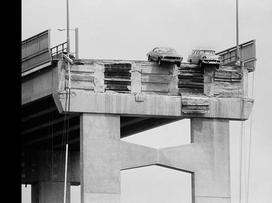 Cars teeter on the edge after the Lake Illawarra struck the Tasman Bridge on January 5, 1975, bringing down two pylons.