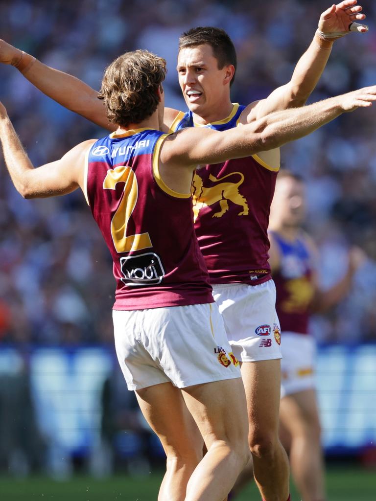 Hugh McCluggage celebrates a goal with Deven Robertson during the grand final. Picture Lachie Millard