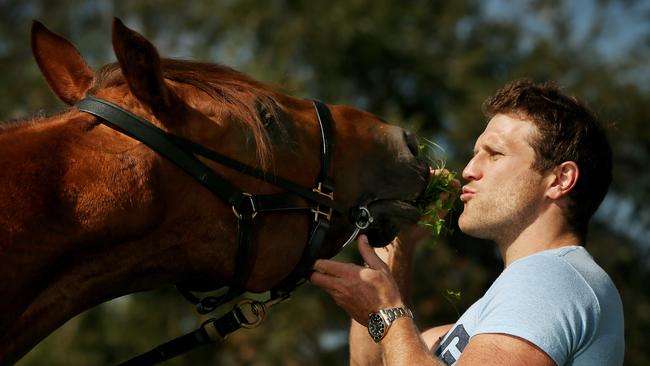 Former footballer Campbell Brown and his filly, Sweet Idea, in 2014. Picture: Colleen Petch.