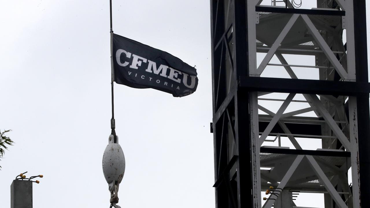 CFMEU flag hanging from a crane on a building site in South Yarra. Picture David Geraghty / The Australian.