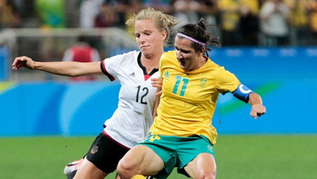 Lisa de Vanna (L) vies for the ball with Tabea Kemme of Germany.