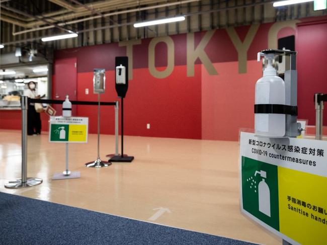 The entry to the Tokyo village. (Photo by Akio KON / POOL / AFP)