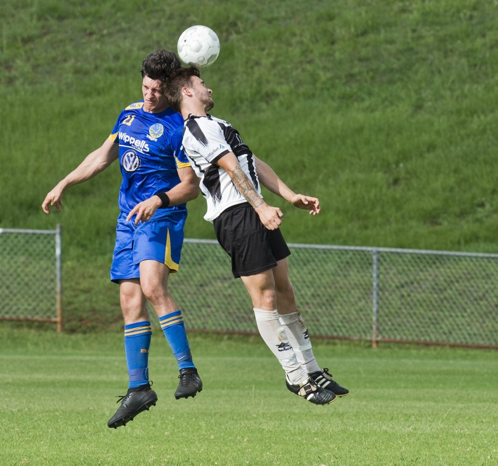 Alex Dyball, USQ and Nikolas Lawson, Willowburn. Football, Willowburn vs USQ. Sunday, 4th Mar, 2018. Picture: Nev Madsen