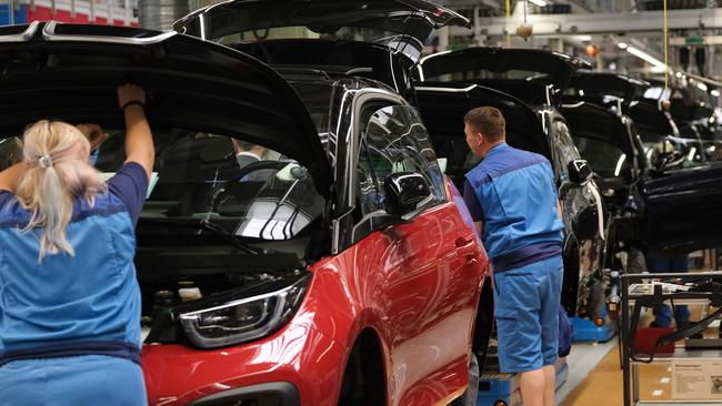 Workers in Leipzig assemble BMW electric cars. Picture: Getty Images