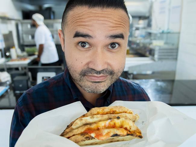 Antimo Iannella tries the pizza a portafoglio at newly opened Francesca's at Glenelg. Picture: Mark Brake