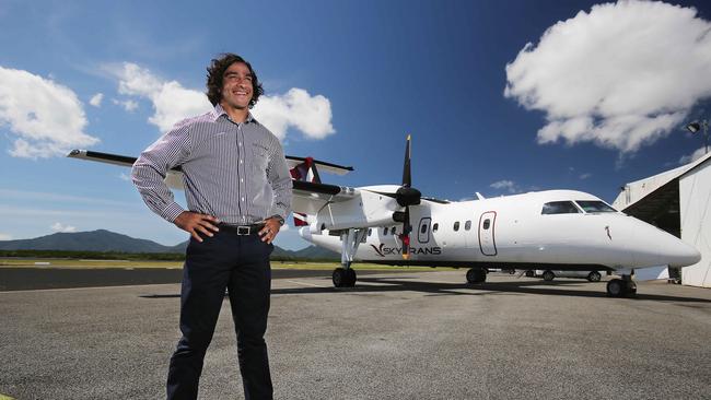 Skytrans co-owner and former North Queensland Cowboys halfback Johnathan Thurston in front of one of his company’s aircraft at Cairns Airport. Picture: Brendan Radke