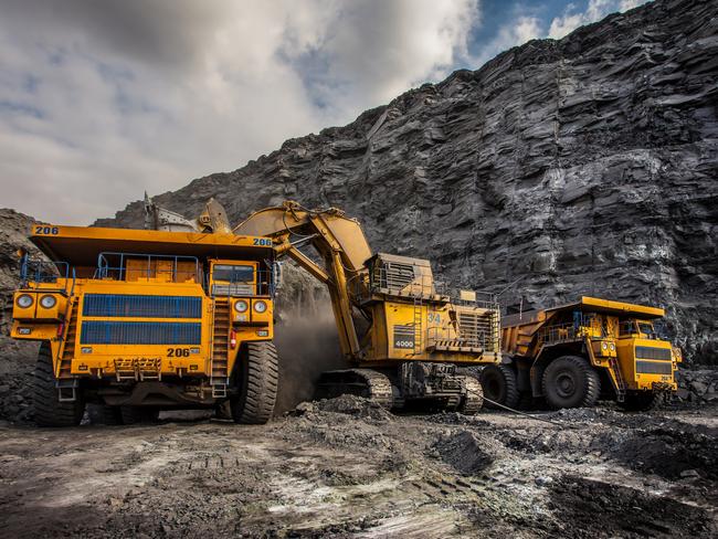 Coal production at one of the open fields in the south of Siberia. Dumpers "BelAZ". September 2015.