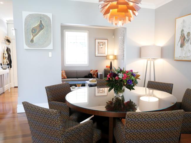 A central pendant light anchors the dining table.