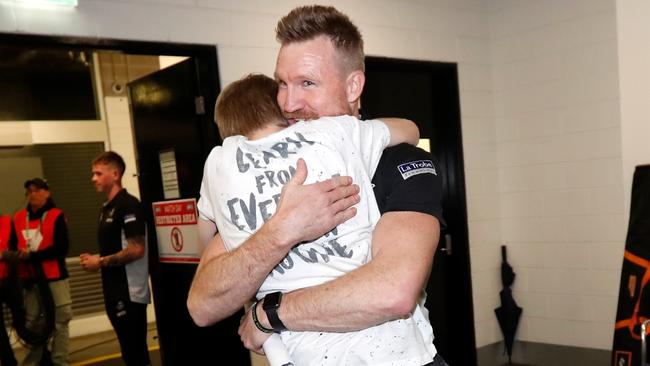 Nathan Buckley and son Jett celebrate the club’s unforgettable upset preliminary final victory against Richmond.