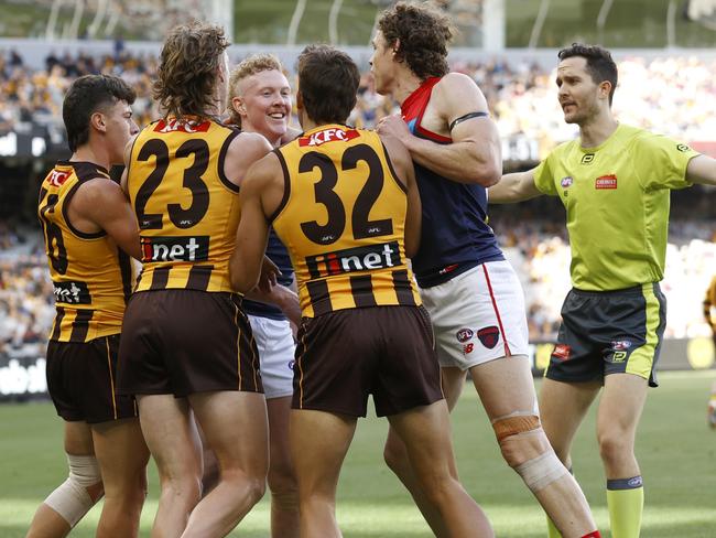 Finn Maginness and the Hawks get in the face of Demons star Clayton Oliver. Picture: Darrian Traynor/Getty Images