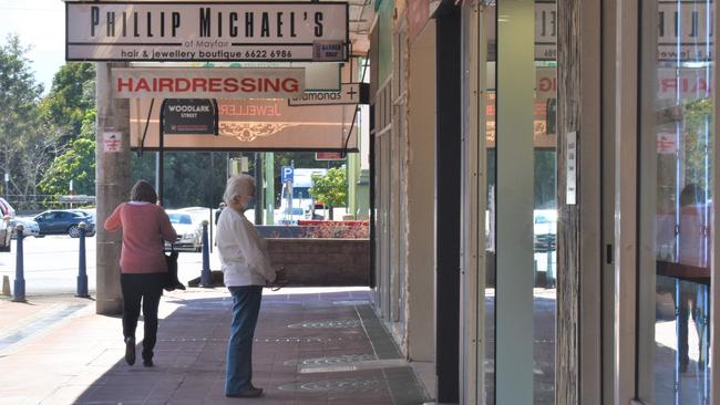 Lismore residents window shop along Molesworth St while wearing masks. Picture: Tessa Flemming