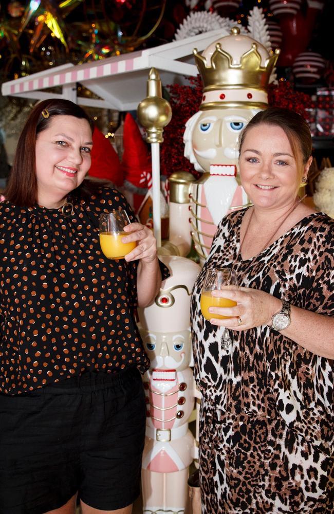 Monique Dews and Amanda McNiven enjoying the exclusive Christmas wonderland showcase at the Prop House in Woolloongabba recently. Christmas came early to The Prop House with owner Jano Kotzas throwing open the doors on the Woolloongabba-based event theming and prop hire company's yuletide wonderland showcasing all the latest in Christmas theming options at an exclusive preview event. Picture: Kim Holloway, Socials: Damien Anthony Rossi