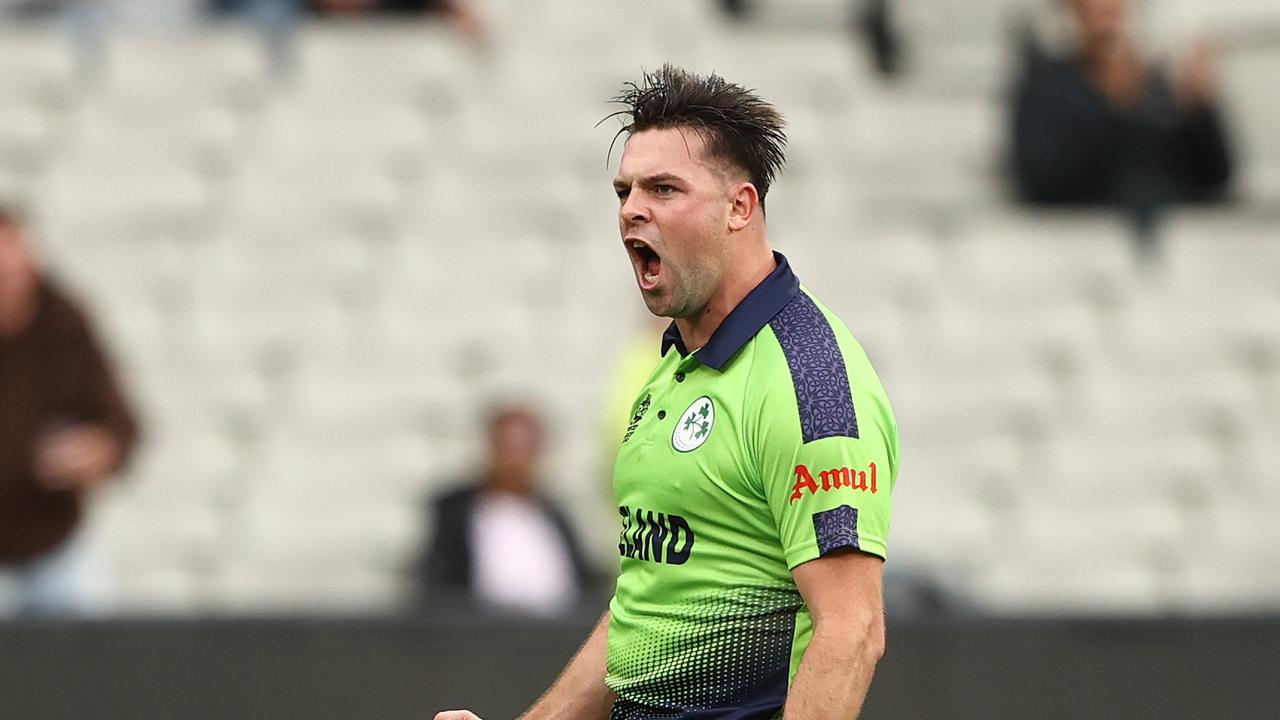 MELBOURNE, AUSTRALIA – OCTOBER 26: Fionn Hand of Ireland celebrates taking the wicket of Ben Stokes of England during the ICC Men's T20 World Cup match between England and Ireland at Melbourne Cricket Ground on October 26, 2022 in Melbourne, Australia. (Photo by Robert Cianflone/Getty Images)