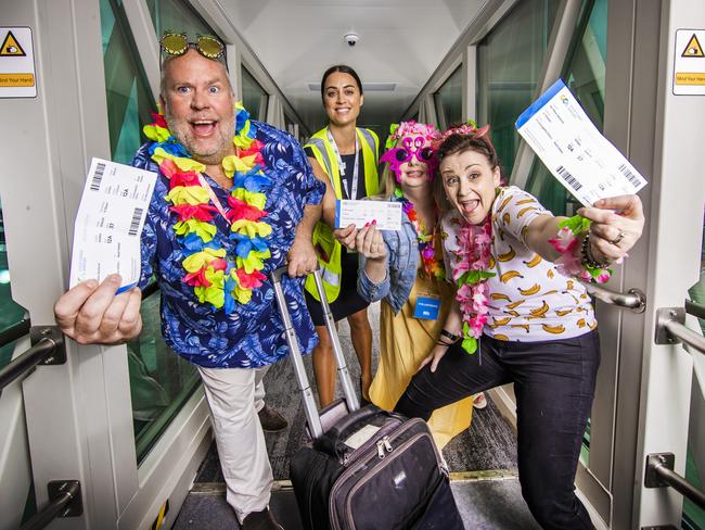 Gold Coast Airport Terminal Operations Leesa Fife with trial holiday makers off to Fiji Ben Foster-Brown, Evie Smith and Christina Vincenzi at the new terminal. Picture: Nigel Hallett.