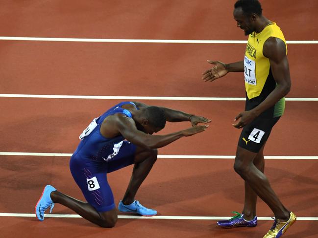 US athlete Justin Gatlin kneels in front of Jamaica’s Usain Bolt after Gatlin won the final of the men’s 100m athletics event at the 2017 IAAF World Championships at the London Stadium in London on August 5, 2017. Picture: AFP