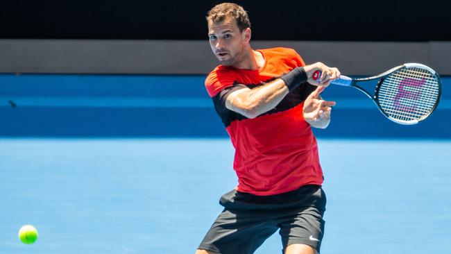 Grigor Dimitrov hits balls at Melbourne Park. Picture: AFP