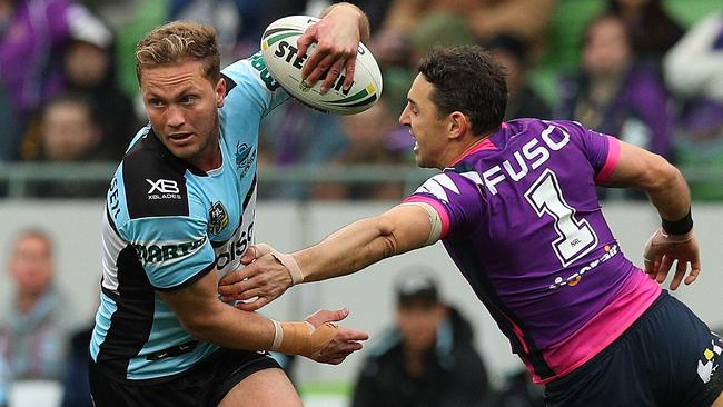 Matt Moylan gets by Storm fullback Billy Slater. Picture: Getty Images