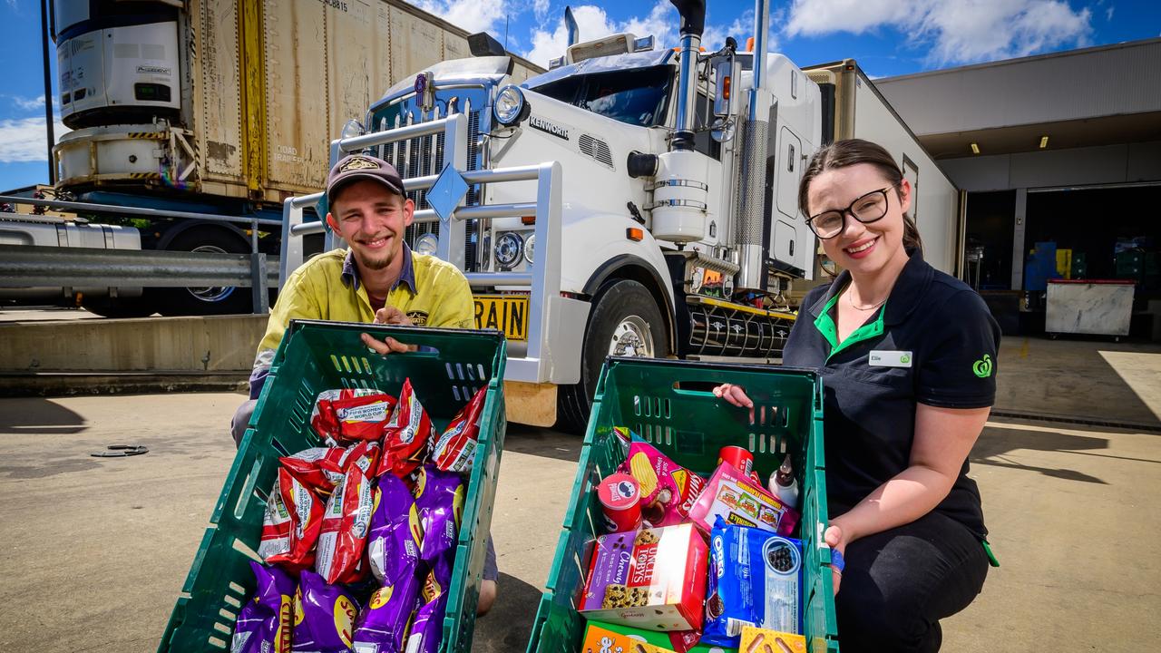 Hayden Bimrose and Woolworths Fairfield Central online manager Ellie Ross work with World Welding and Transport Services as part of the Last Mile run. Picture: News Corp Australia