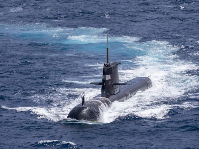 Submarine HMAS Rankin sails on the surface in the waters north of Darwin during AUSINDEX 21. *** Local Caption *** Royal Australian Navy and the Indian Navy are training together in the biennial AUSINDEX 21 maritime warfare exercise. AUSINDEX 21 runs from 7 to 13 September and includes a contactless, COVIDSafe harbour phase in Darwin followed by a sea phase in the North Australian Exercise Area. Royal Australian Navy Anzac class frigate HMAS Warramunga will train alongside Indian Navy warships IN Ships Shivalik and Kadmatt. The ships will be joined by an Royal Australian Navy submarine, Royal Australian Air Force P-8A and F-18A aircraft, as well as embarked helicopters from both navies. First held in 2015, AUSINDEX has increased in complexity with each iteration. The successful 2019 event in India saw the first anti-submarine warfare exercises and first coordinated P-8 aircraft missions over the Bay of Bengal. This is the first time AUSINDEX has taken place in the waters off Darwin