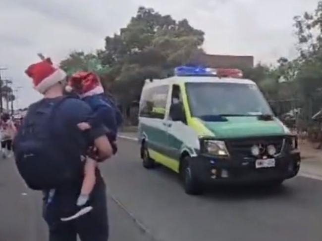 An out-of-control car has caused a major scare at the Port Adelaide Christmas Pageant, with participants being treated for shock after almost being hit. Picture: NINE NEWS