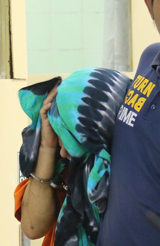 Australian Sara Connor is escorted by police for a physical examination at Sanglah Hospital in Denpasar, Bali. Picture: Lukman S.Bintoro