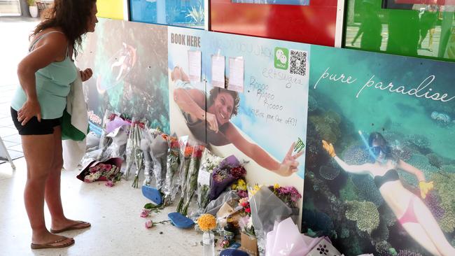 Flowers, hand written notes and other items left by the friends of murder victim Jack Beasley at the scene of the tragedy outside the Surfers Paradise IGA. Photographer: Liam Kidston.