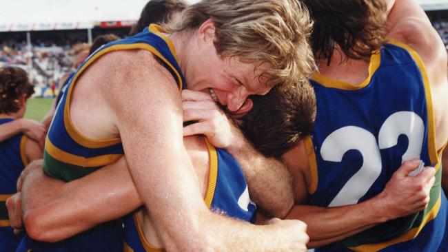 Andrew Taylor (left) hugs Steven Sziller after win. SANFL football — Woodville-West Torrens Eagles vs Norwood Grand Final match at Football Park 02 Oct 1993. (Pic by staff photographer Martin Jacka)