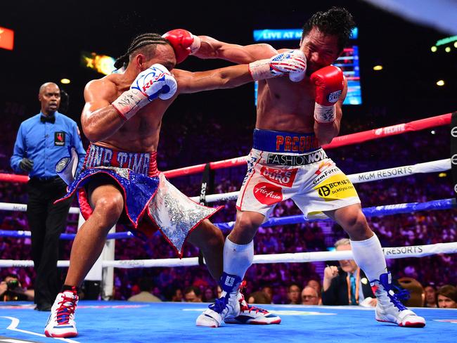 Pacquiao (R) didn’t have it all his own way against Keith Thurman (L). Picture: Kohjiro Kinno /Sports Illustrated/Getty Images