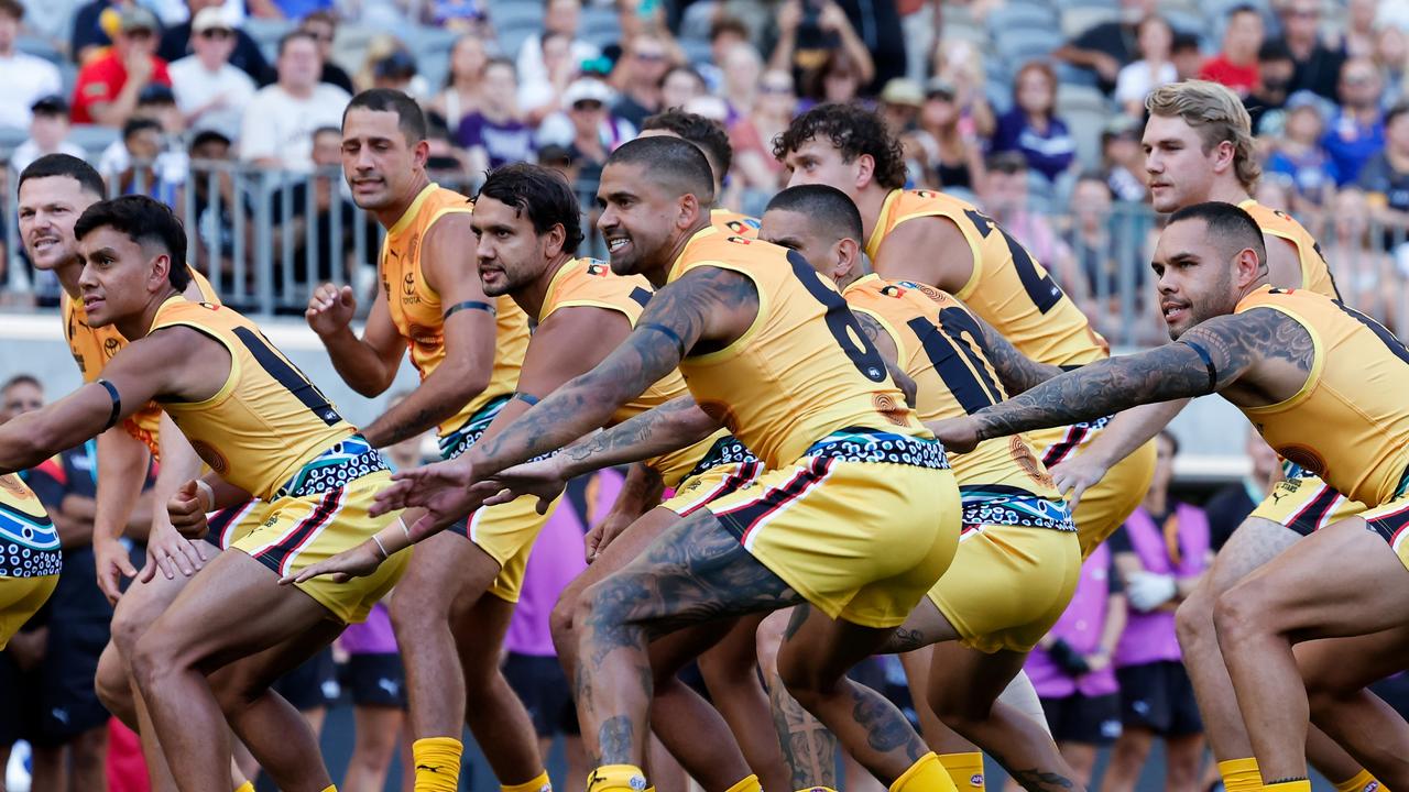 The Indigenous All Stars doing their war cry. (Photo by Dylan Burns/AFL Photos via Getty Images)