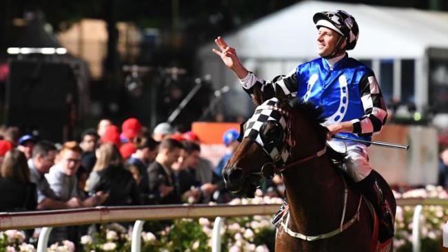 Hugh Bowman salutes the crowd after winning the Manikato Stakes on Brave Smash. Picture: AAP