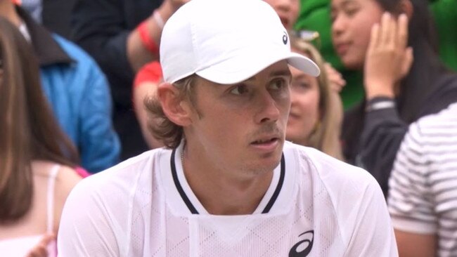 Alex de Minaur did not celebrate his fourth round win and looked at his player box in a concerned manner.